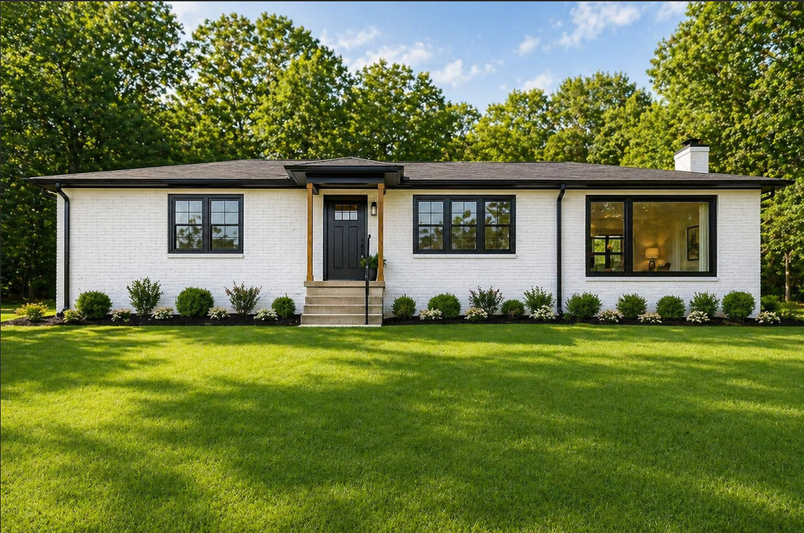 Painted brick ranch exterior with black trim and landscaping