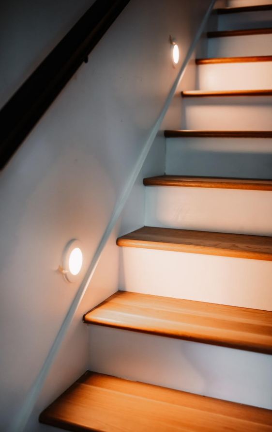 Staircase addition with wood treads and step lighting
